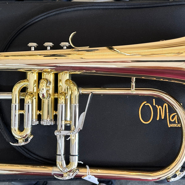 Gold flugelhorn on a black case with 'O'Malley' branding.